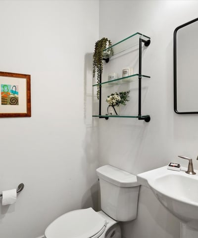 Contemporary powder room featuring clean lines, modern fixtures, and tasteful finishes. Perfectly appointed for guests in this Scottsdale home.