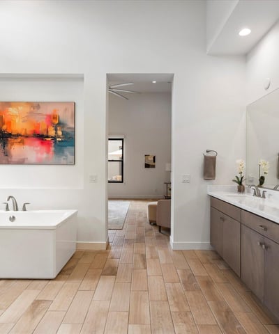 Modern primary bath highlighting a freestanding tub and serene design. This Scottsdale luxury bathroom delivers spa-style comfort and timeless elegance.