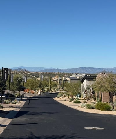 View of the neighborhood streetscape highlighting clean asphalt roads, contemporary desert architecture, and scenic mountain backdrops that define this refined Scottsdale community lifestyle.