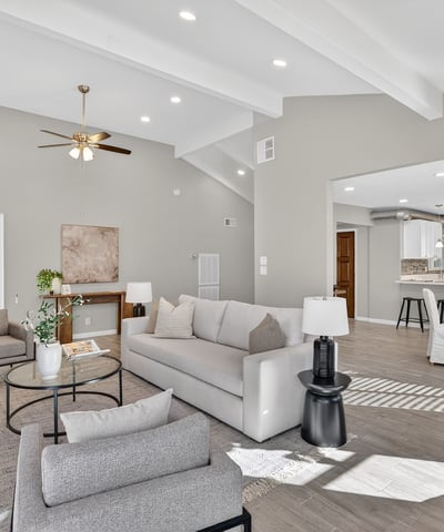 Expansive living area with vaulted ceilings, recessed lighting, and an open layout designed for comfortable entertaining.