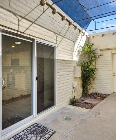 Quiet courtyard patio providing a private outdoor escape with low-maintenance design and indoor-outdoor flow.