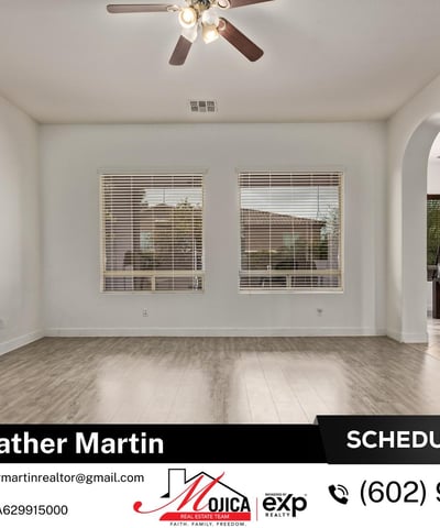 Dual windows fill this family room with natural light while maintaining privacy. The open layout enhances flow throughout this Glendale home for sale with private backyard pool.