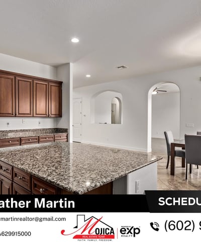 Featuring a gas cooktop, built-in microwave, and granite counters, this kitchen is designed for efficiency. The generous storage and prep space make it a standout in this Glendale pool home.