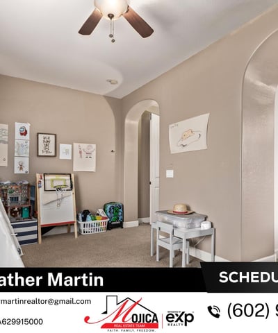 This inviting secondary bedroom includes plush carpet, ceiling fan, and neutral paint tones. A functional and cozy space within this Glendale home featuring updated kitchen and backyard pool.