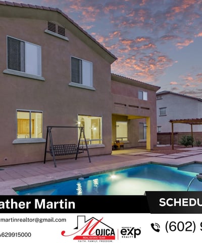 Evening lighting showcases the inviting covered patio and shimmering pool. Designed for entertaining, this Glendale home offers seamless indoor-outdoor flow and energy-efficient comfort.