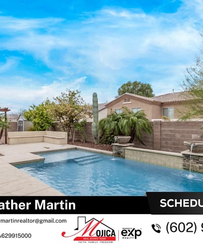 The backyard pool with dual water features creates a tranquil setting perfect for relaxation. Surrounded by pavers and desert landscaping, this Glendale property offers a stylish and functional outdoor retreat.
