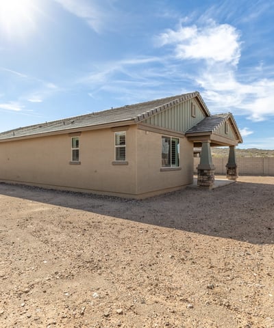 Wide backyard with privacy fencing and distant mountain views, offering a peaceful setting and room to customize.