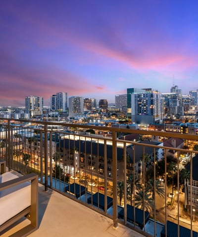Inviting balcony space with seating and sweeping city views, ideal for relaxing and enjoying the Phoenix skyline.