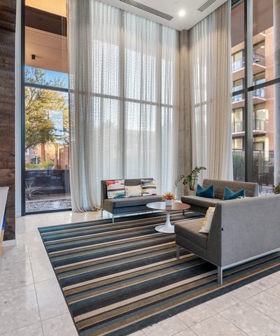 Dedicated media space with contemporary seating and large windows, ideal for entertainment and leisure in Phoenix.