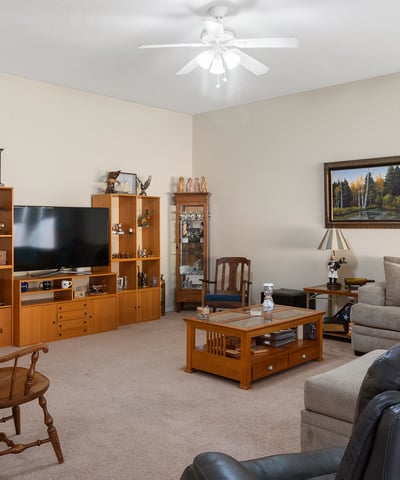 Spacious Phoenix living room with neutral finishes, ample seating, and inviting atmosphere designed for everyday comfort and gatherings.