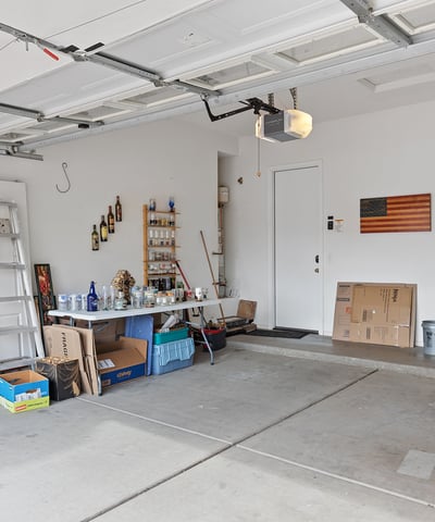Spacious garage offering room for vehicles, tools, and storage, providing versatility and practicality in this Phoenix property.