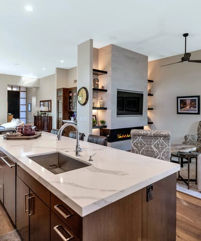 Spacious layout combining kitchen, dining, and living areas with a large island and modern finishes in this Phoenix property.
