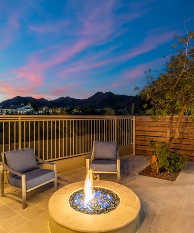 Private patio with modern fire feature and comfortable seating, offering breathtaking Scottsdale mountain views and peaceful outdoor ambiance.