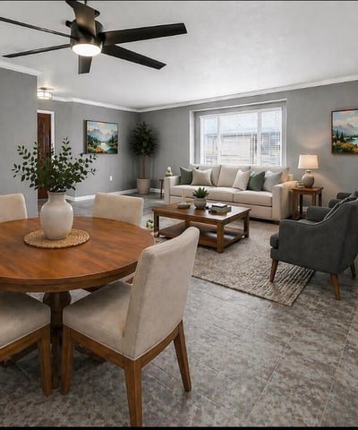 Stylish open concept living and dining space with modern flooring and ceiling fan. This Sun City home features updated interiors perfect for entertaining and everyday comfort
