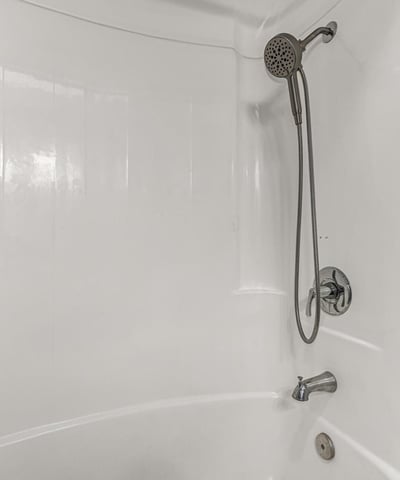 Clean bathroom featuring a tub and shower combo with modern fixtures. This Sun City home includes functional spaces and updated details.