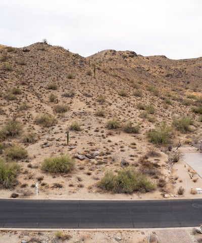 Elevated desert homesite with nearby hiking trail access and scenic mountain views. This Phoenix property combines natural desert beauty, privacy, and luxury custom home potential in a highly desirable hillside location.