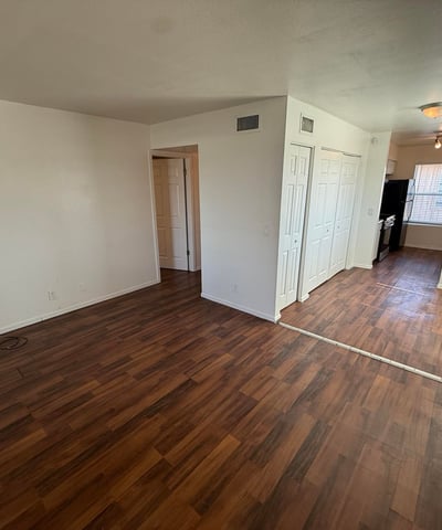 Versatile living space featuring durable flooring, abundant wall space, and an open floor plan. Natural light and flexible room arrangements enhance the home's comfortable and inviting atmosphere.
