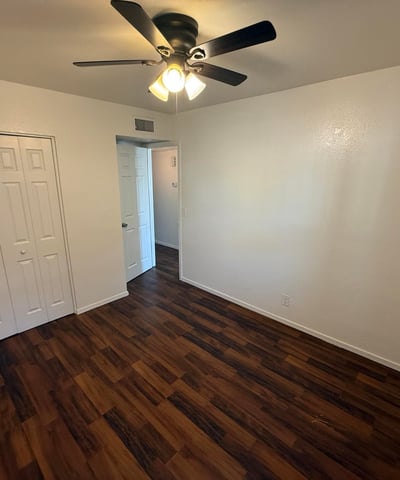 Well-sized bedroom with generous closet storage, ceiling fan, and attractive flooring. Ideal as a guest room, home office, or primary sleeping area within this Glendale apartment home.