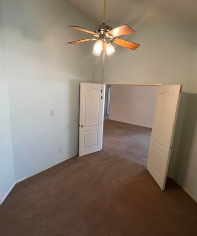 Spacious bonus room featuring high ceilings and flexible use potential. Perfect for remote work, guests, a fitness area, or additional living space tailored to your needs.