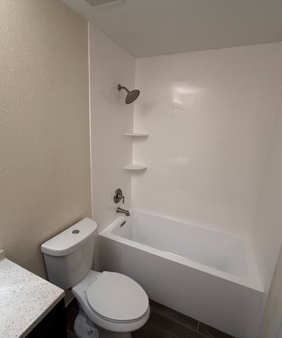 Clean and inviting full bathroom offering a tub and shower combination, updated vanity, and contemporary fixtures. Functional design meets everyday comfort while enhancing the home's move-in-ready appeal.