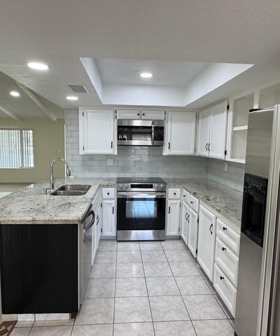 Bright kitchen offering extensive counter space, stainless appliances, and ample cabinet storage. The open layout makes meal preparation and entertaining easy.