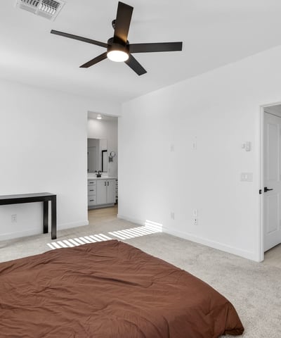 Featuring generous dimensions, soft natural light, neutral finishes, and direct access to the ensuite bath, this comfortable primary bedroom creates a relaxing owner's retreat.