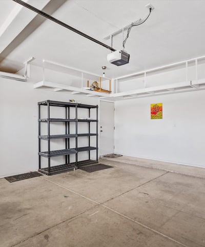 This oversized garage includes built-in overhead storage racks, shelving, and plenty of room for vehicles, hobbies, and equipment. An organized and practical feature that adds value to this Chandler property.