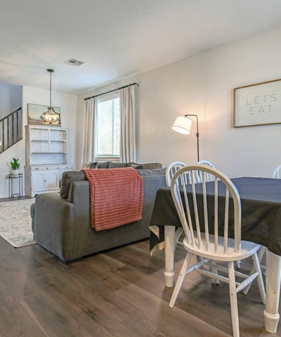 Bright dining area with seamless access to the living room and kitchen, offering an ideal setting for family meals, celebrations, and memorable gatherings in this move-in-ready Waddell home.