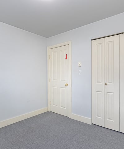 Bright, versatile room with ample closet storage and neutral tones, perfect for personalizing to your taste.