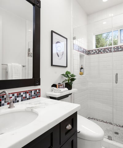 Bathroom 2-Modern bathroom featuring a spacious walk-in shower, sleek fixtures, and vibrant tile accents.