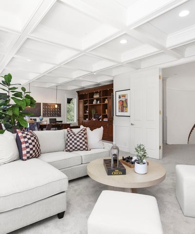 Stunning Coffered ceilings welcome you into the perfect entertaining space with room for a movie night, games party or even space for work/school desk and more (includes TV)