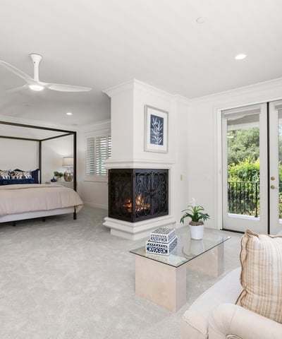 Bedroom 3-Spacious Primary bedroom suite featuring a cozy fireplace and direct access to a private balcony with private views galore