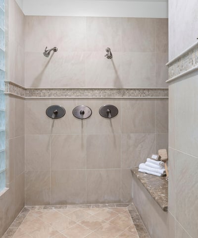 Primary Bathroom-Discover a spacious walk-in shower featuring dual showerheads and modern finishes, perfect for daily relaxation.