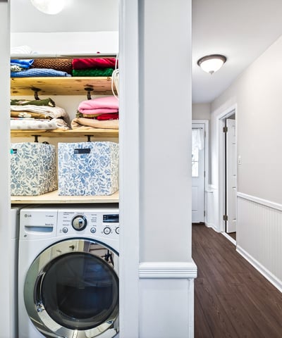 Efficient laundry closet with storage.
