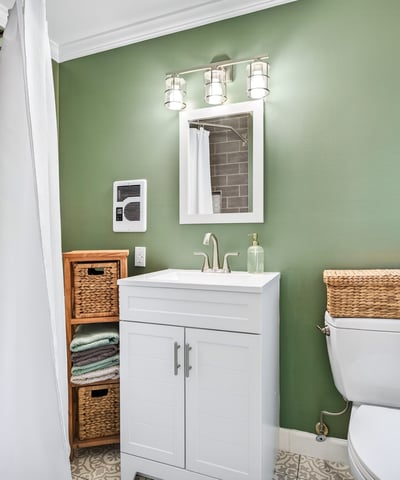 Chic bathroom with calming green hues.