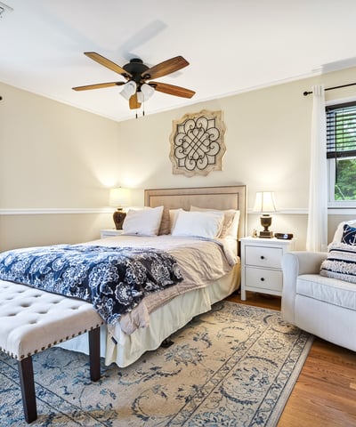 Serene primary bedroom with natural light.