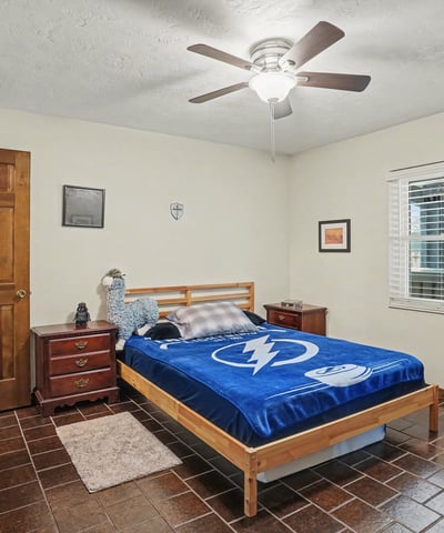 First bedroom, located off of the foyer, with has two doors to access it. One door is across from the guest bathroom for easy accessibility, while the other door is off of the foyer.