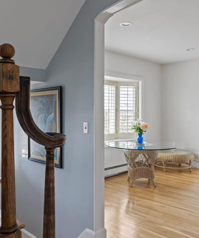 Welcoming foyer leads to an airy dining area, featuring natural light and quality craftsmanship throughout.