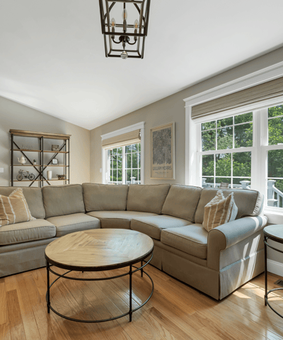 Bright, inviting living space featuring abundant natural light and modern furnishings, perfect for relaxation and gatherings.