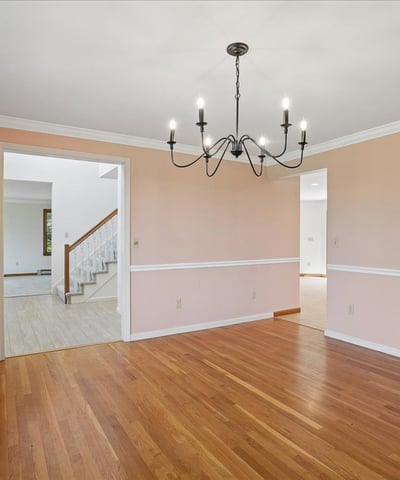 Bright and inviting space featuring hardwood floors, large windows, and an open layout perfect for gatherings.