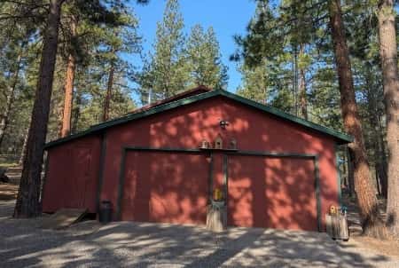 47 of 61. The 2-car oversized garage has heated storage, dedicated wood storage, and a storage room. Plus exterior shed and wood storage.