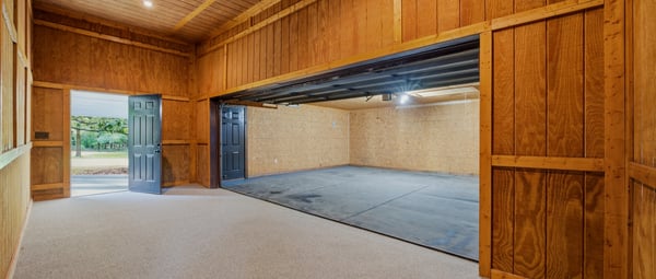 Spacious flex space perfect for a workshop, studio, or weight room.