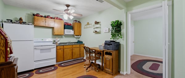 Cottage features a covered front porch, an open living area, kitchenette, private bedroom, and full bath. A versatile space that offers flexibility and functionality, perfect for hosting guests, working from home, or creating a studio or hobby space.