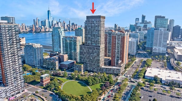 Modern high-rise with stunning skyline views, situated near vibrant waterfront parks and bustling city amenities.