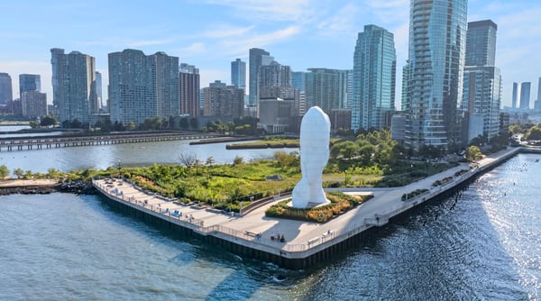 Discover waterfront living with stunning skyline views and unique public art in this vibrant urban community.
