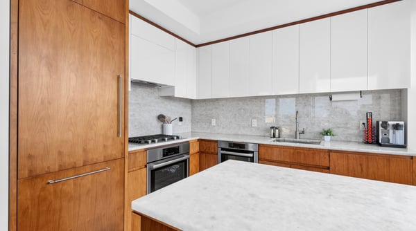 Modern kitchen featuring sleek cabinetry, spacious island, and high-end appliances for effortless cooking and entertaining.