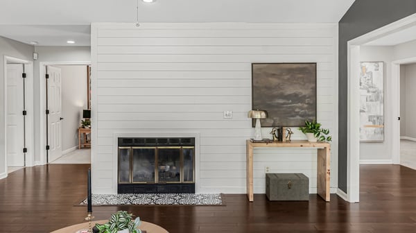 Bright and inviting living space featuring a cozy fireplace and modern design elements throughout.