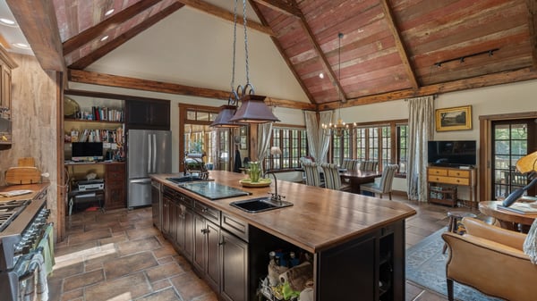 This spacious kitchen features vaulted ceilings and a large island, perfect for entertaining and family gatherings.
