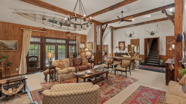 Spacious open-concept living area with rustic wood accents and a unique nautical theme throughout.