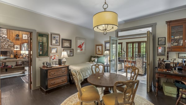 Cozy dining area with natural light, featuring vintage decor and easy access to the inviting living space.